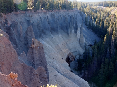 [Semi-circular ridge leading down to the water. On the ridge are dozens of pinnacles.]